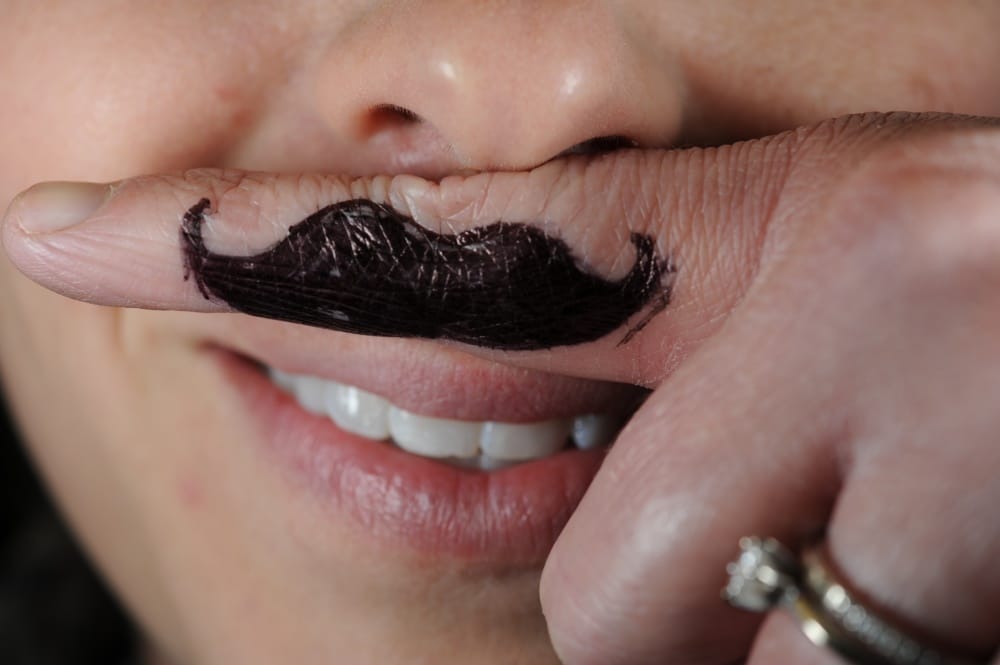 faux mustache drawn on finfer