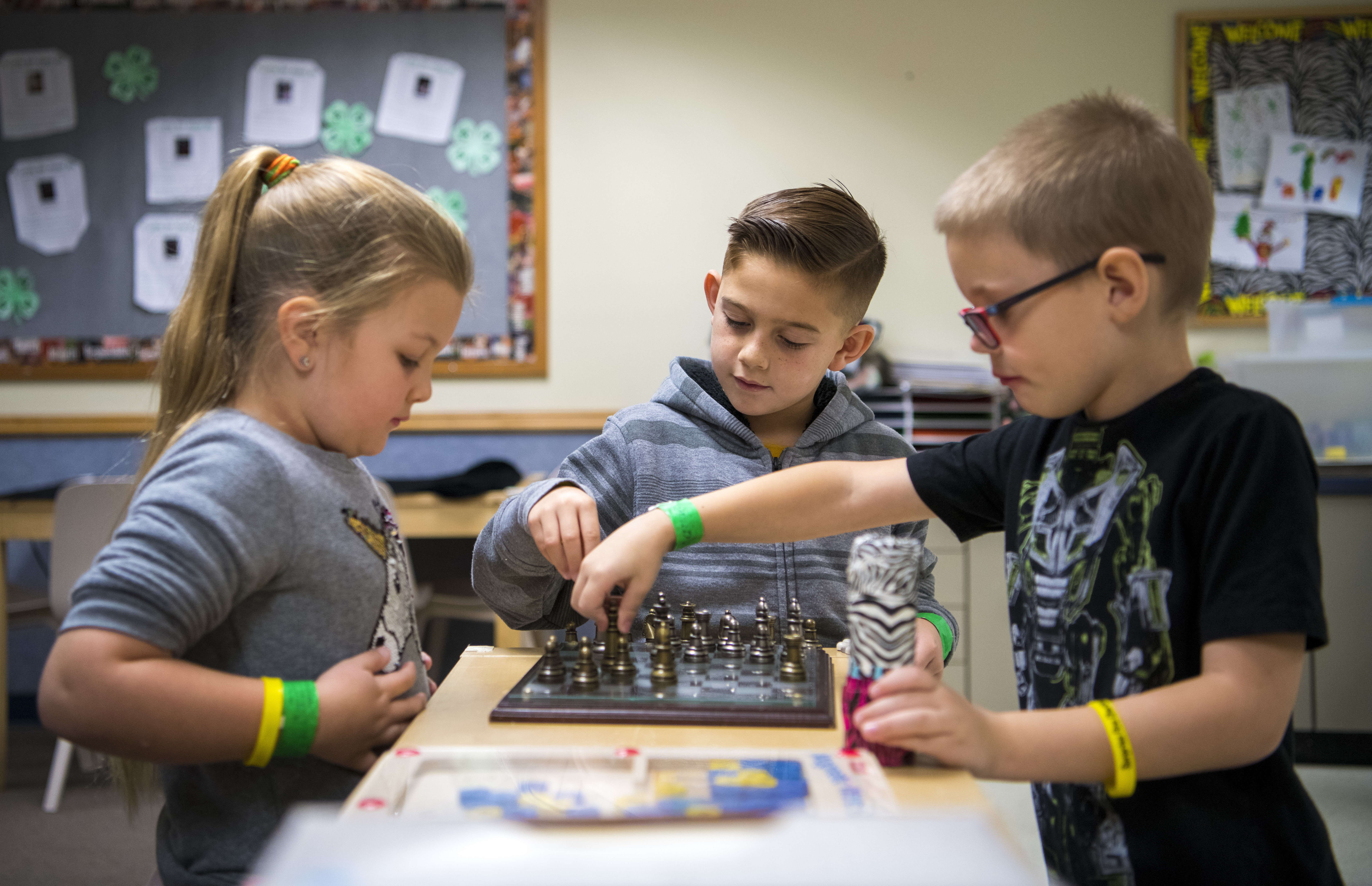 Students from Dysart Unified School District play chess during the Youth Center Winter Break Camp Dec. 31, 2019, at Luke Air Force Base, Ariz. During the camp, volunteers from the base immersed the children in hands-on activities related to education including: physical fitness, life skills, science, technology, engineering, math and art. The center supports military and civilian personnel based at Luke AFB by providing affordable programs for eligible children ages birth through 18; however, the staff conducted for the first time a cross-educational program integrating children from the base and the community where they can accomplish fun, educational activities. (U.S. Air Force photo by Senior Airman Jacob Wongwai)