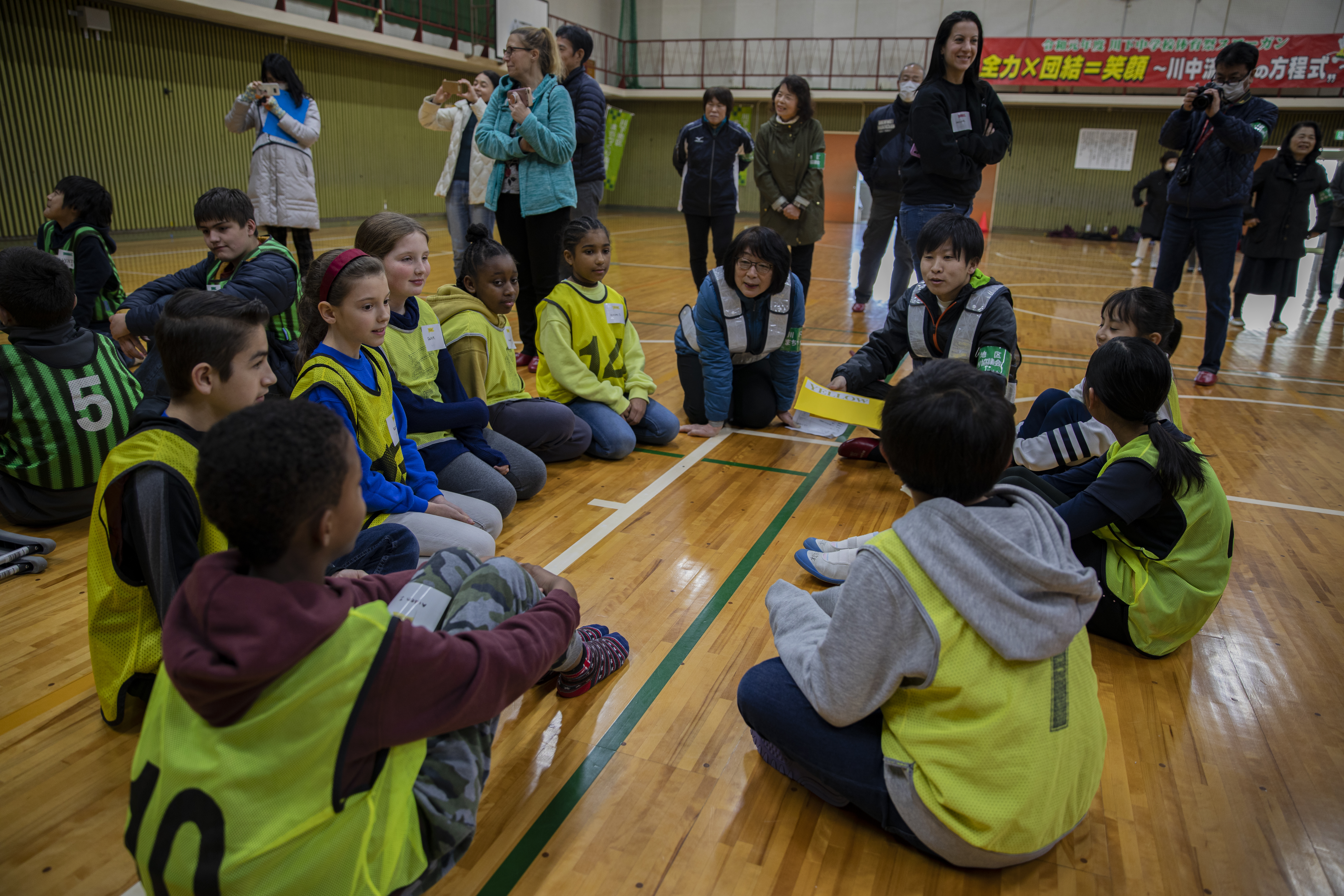 Students from Iwakuni Middle School and Kawashimo Junior High School play an interactive game during a cultural exchange event at Kawashimo Junior High School, Iwakuni City, Japan, Feb. 11, 2020. This annual event allows middle school students from two different cultures to interact with each other.The exchange provided an opportunity for children from the air station to have a friendly competition with local Japanese students. (U.S. Marine Corps photo by Lance Cpl. Triton Lai)