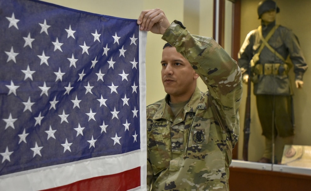 the army reserve: reservist holds american flag