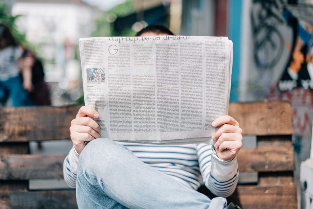 man holding newspaper