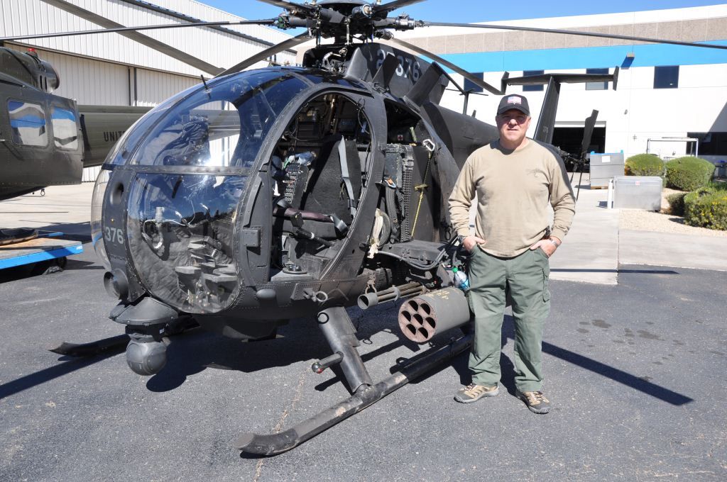 Chief Greg Coker alongside one of the newer versions of the AH-6 Little Bird. Coker has written a superb account about the AH-6 in battle and the Night Stalkers. You can purchase the book&nbsp;<a href="https://www.amazon.com/Death-Waits-Dark-Guns-Dont-ebook/dp/B08QBNZDFQ" target="_blank" rel="noreferrer noopener">here</a>. (Courtesy picture).