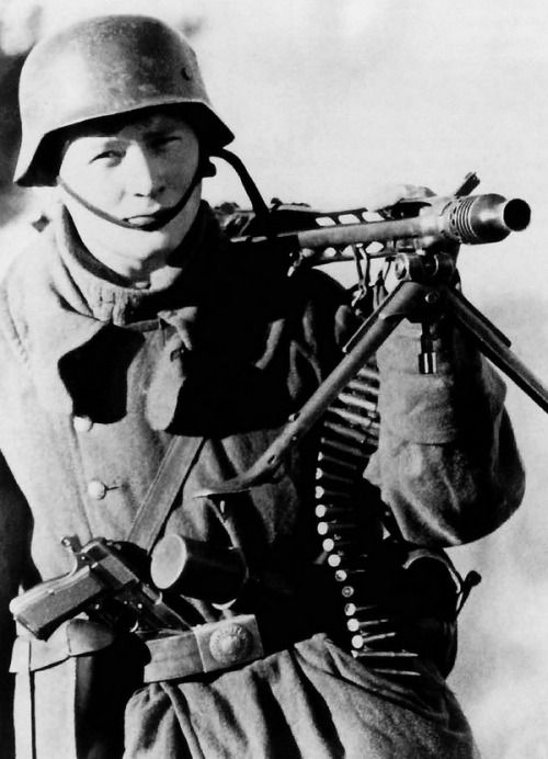 A German WWII soldier carrying the Browning Hi-Power pistol. 