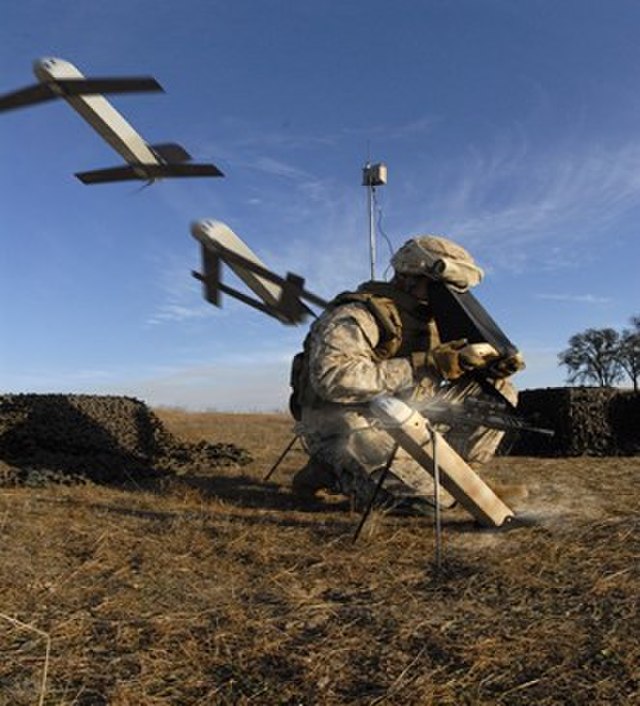 A soldier launches a Switchblade drone