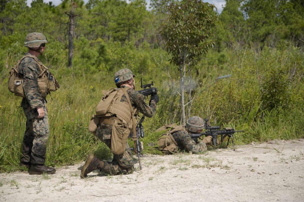 soldier firing a grenade launcher