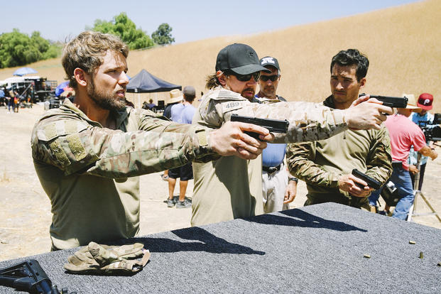 Delta Force operator Tyler Grey teaches SEAL Team actors how to use guns