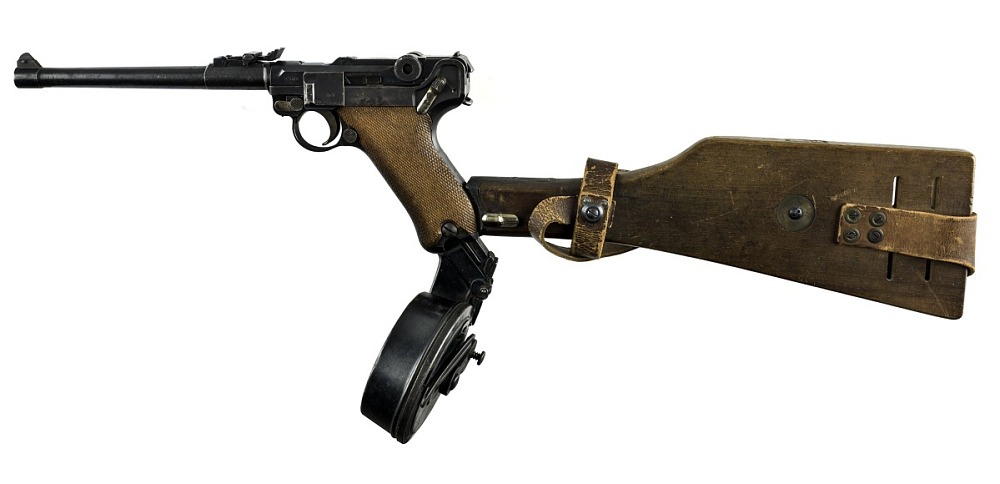 stocked handgun with a drum