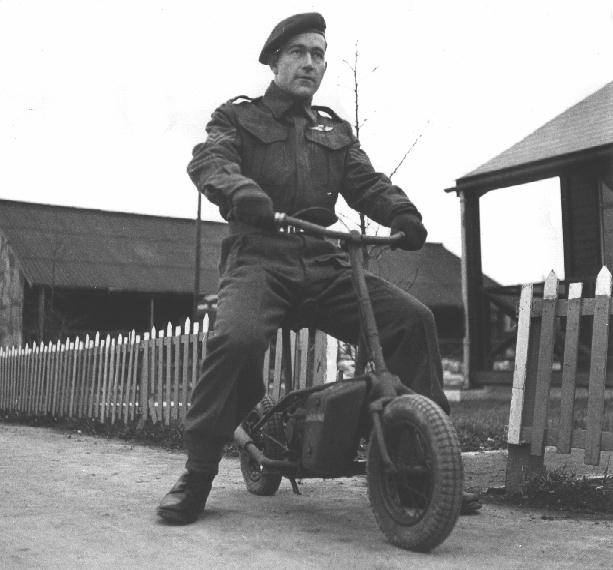 a British soldier riding a Welbike