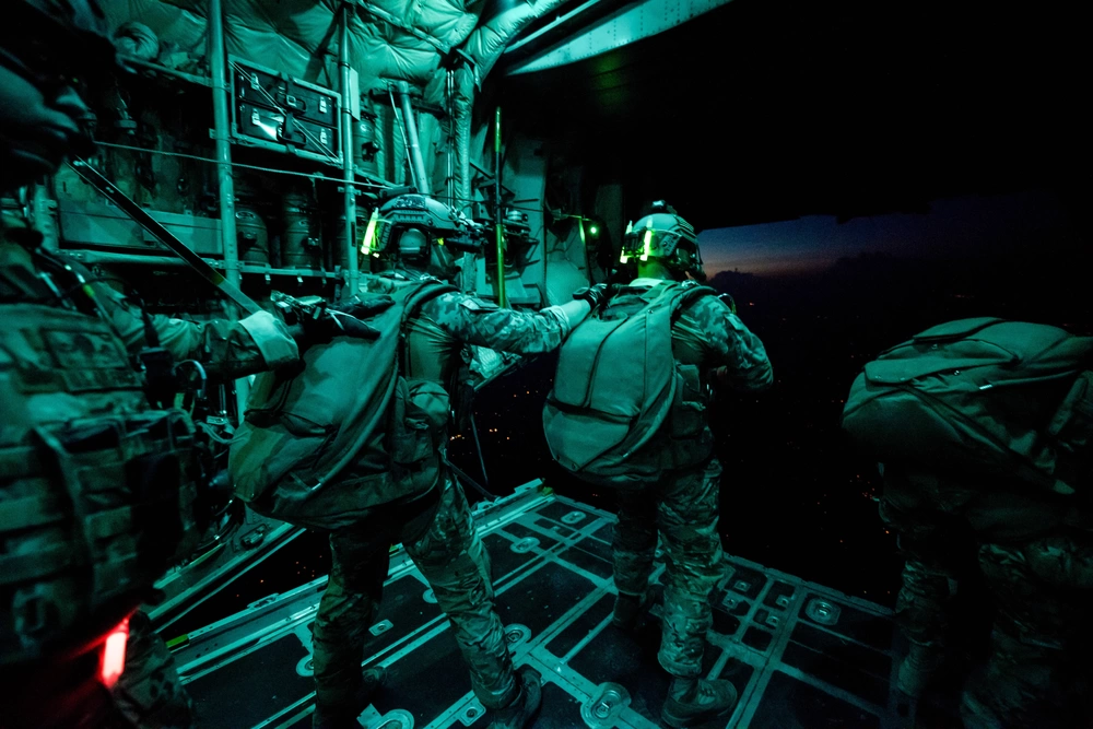 Special Forces jump from a C-130 during  night training mission