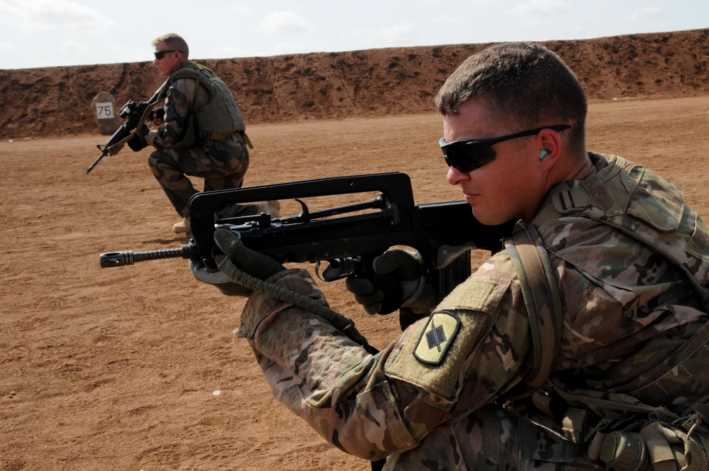 FAMAS rifle training US Army National Guard. Using burst fire makes more sense with a FAMAS