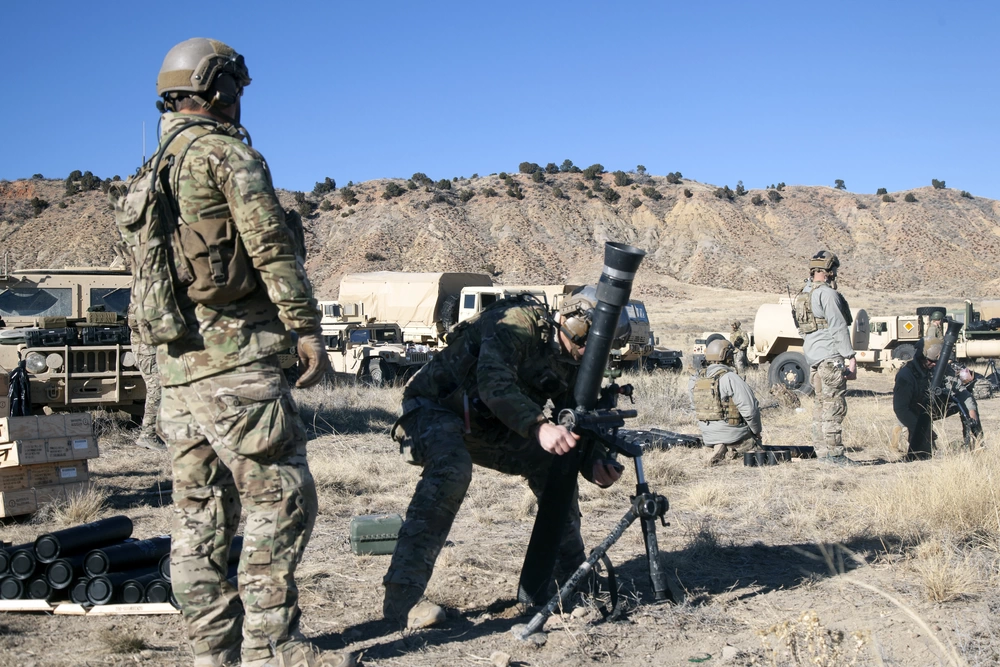 Special Forces Green Berets adjust a mortar