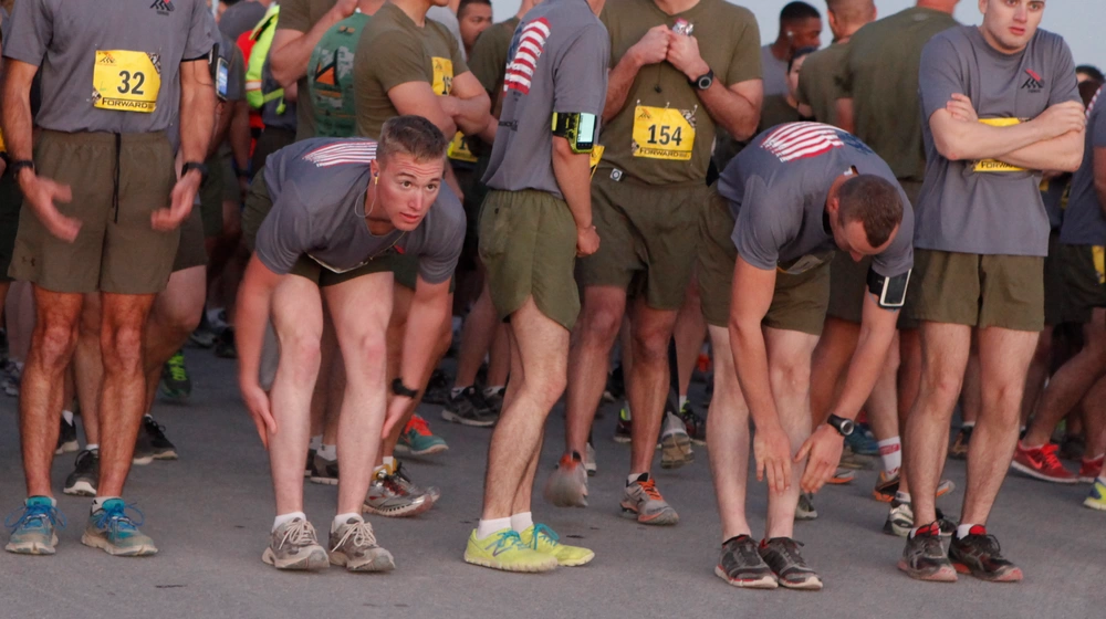 Marines stretch before marathon