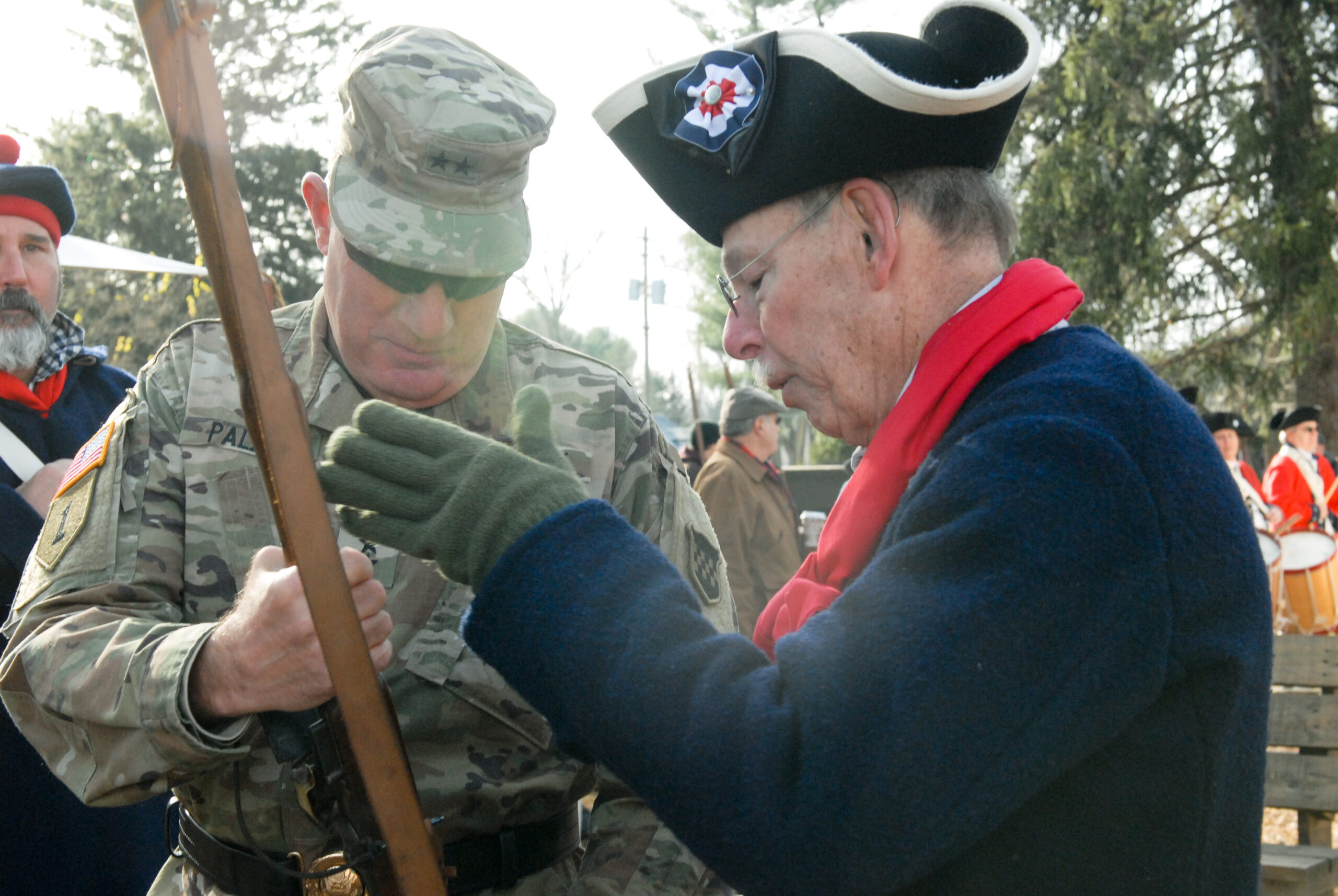Maj. Gen. Mark Palzer, commanding general of the U.S. Army Reserve’s 99th Readiness Division (left), prepares to fire a musket with help from Army Reserve Ambassador Larry Rubini during the 67th annual re-enactment of Gen. George Washington crossing the Delaware River Dec.8 at Washington Crossing Historic Park in Washington Crossing, Pennsylvania. This event commemorates Washington’s actual crossing Dec. 25-26, 1776, when he led several thousand troops across the icy river to conduct a surprise attack on enemy forces in Trenton.