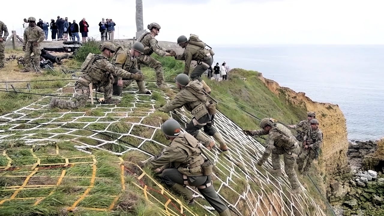 Modern rangers scaling Pointe du Hoc