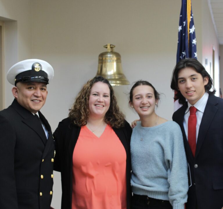 dong garcia standing with his wide and two kids, Don is wearing a Navy uniform