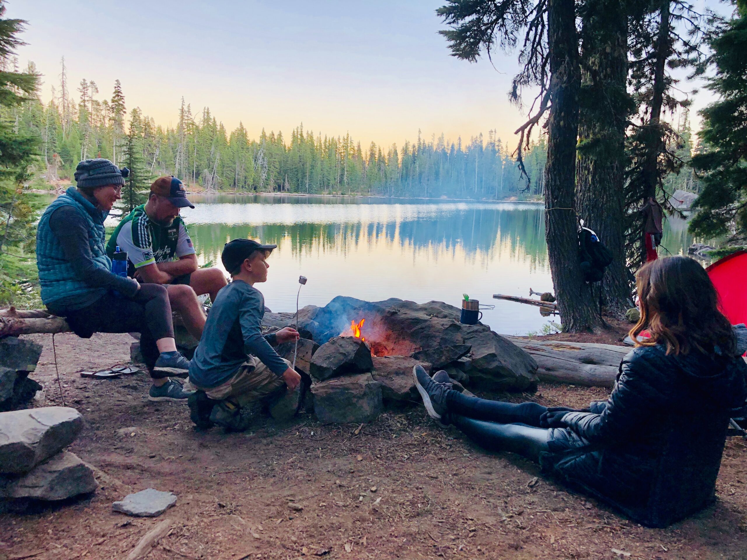 family around campfire