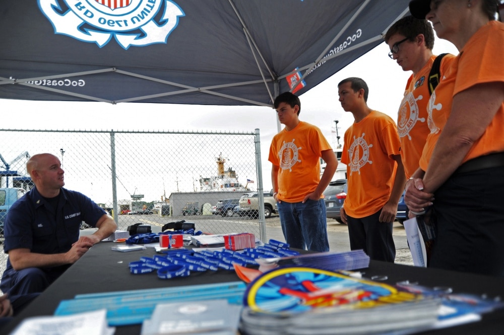 u.s. coast guard member talks to young kids