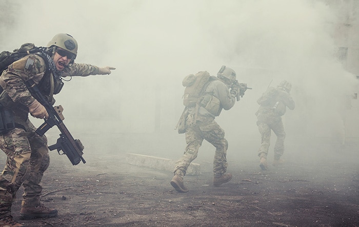 soldiers move into the smoke and fog of battle