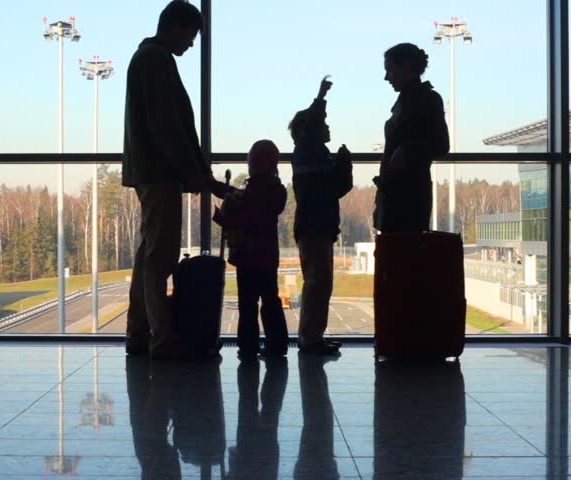 family-airport-window