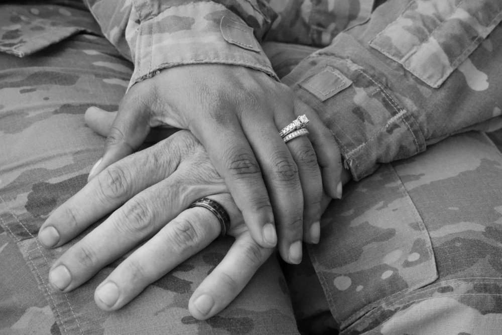 military counseling: black and white photo of couple holding hands