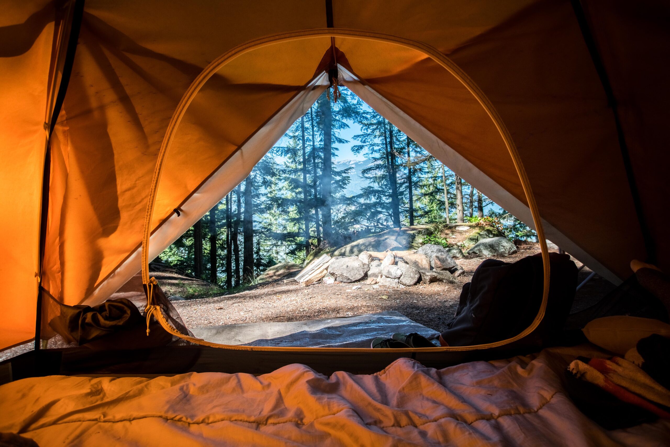 the view looking outside from the inside of a camping tent