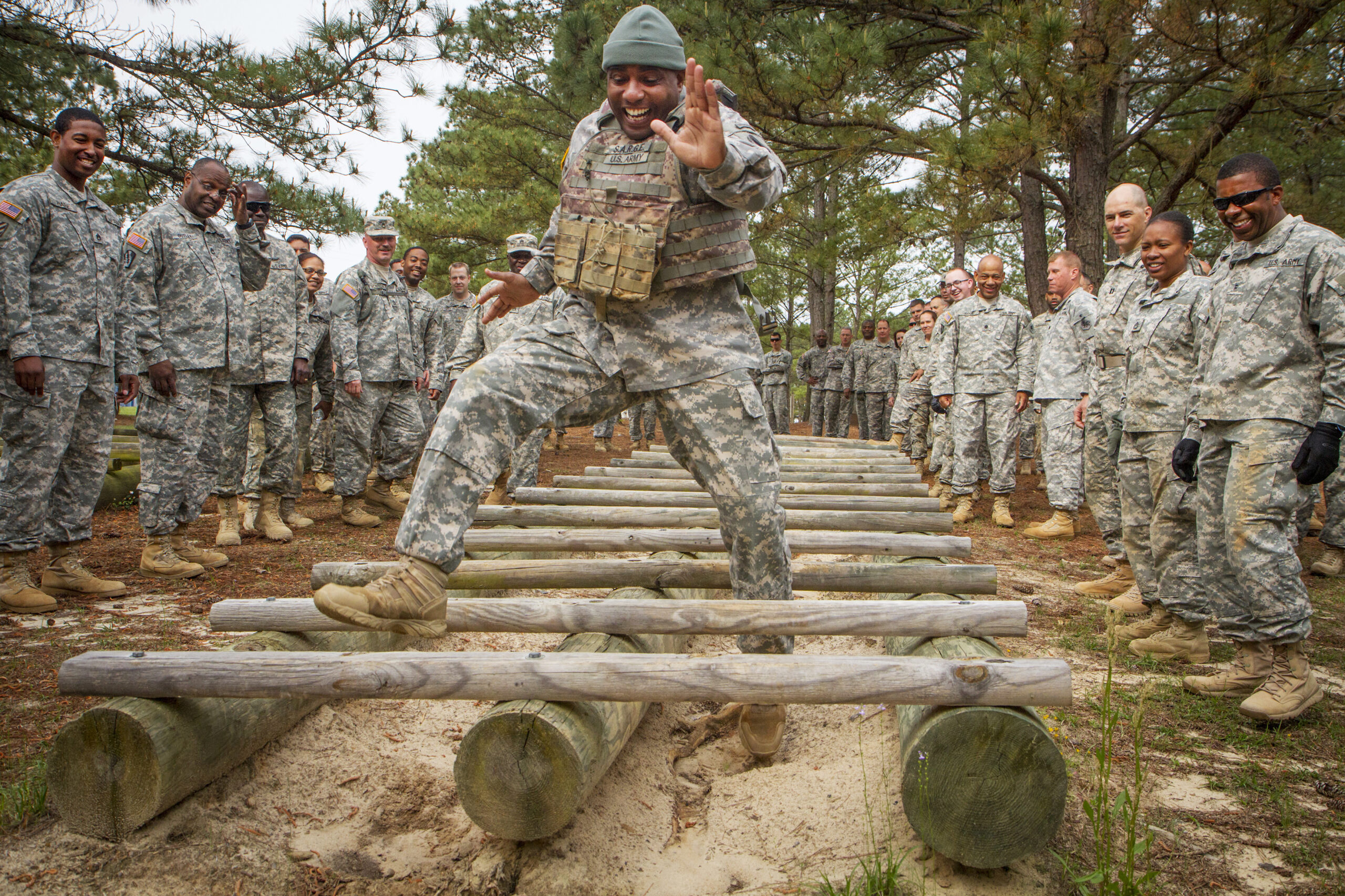 soldier does high-step through horizontal ladder obstacles 