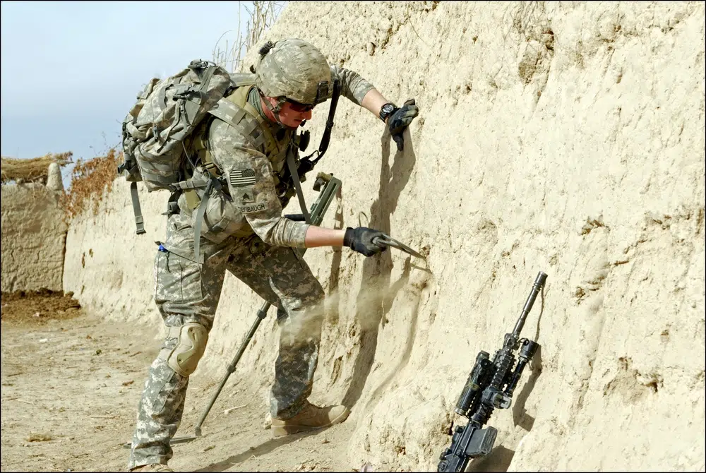 soldier uses hatchet Afghanistan