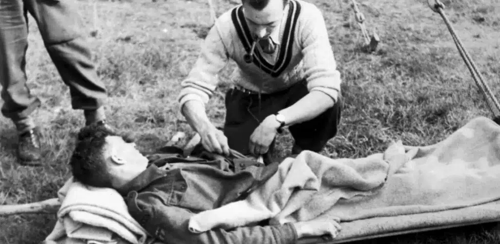 doctor helping soldier WWII