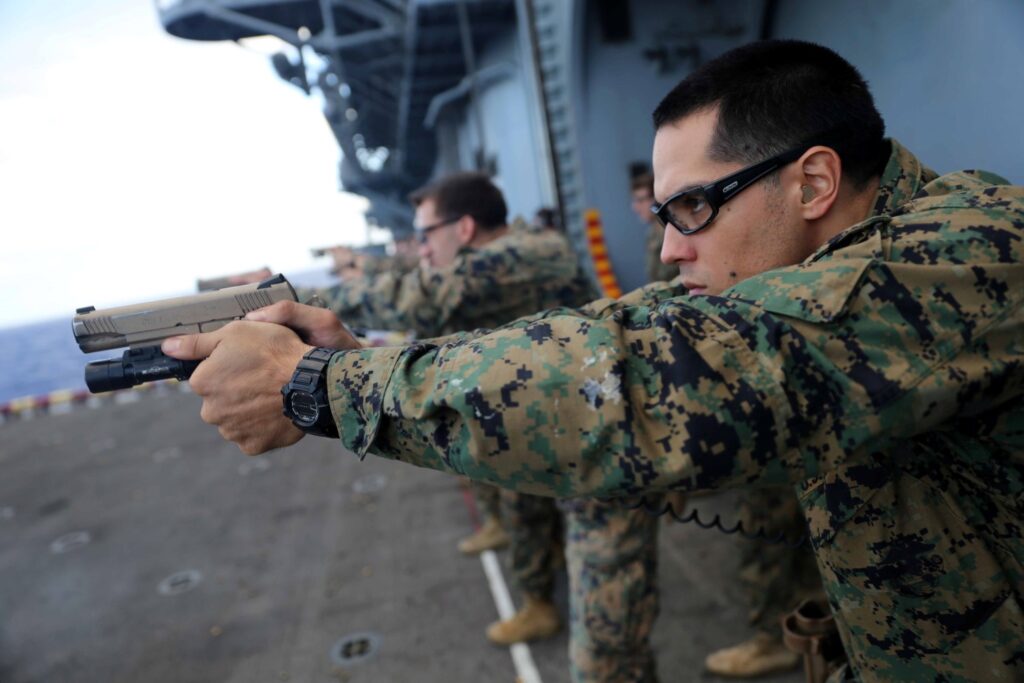Marines firing pistols
