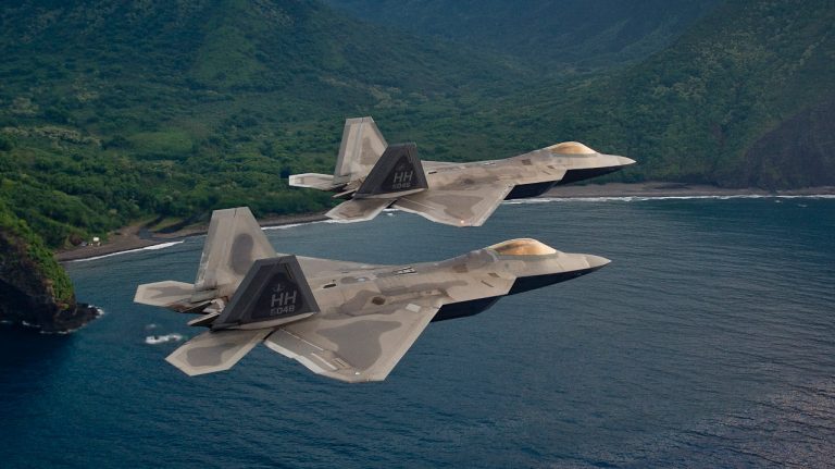 F-22s fly in formation