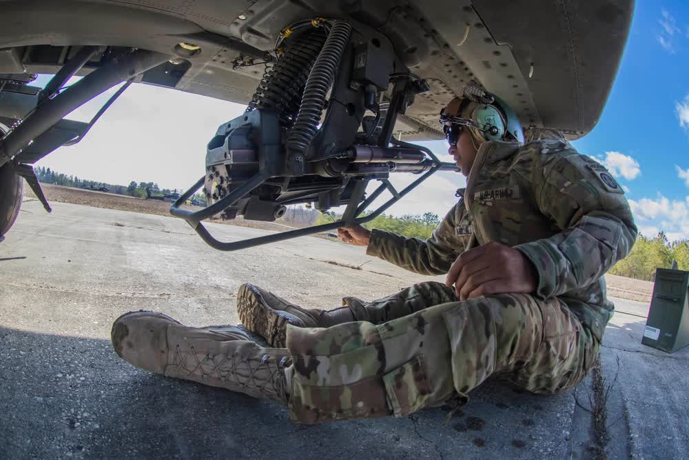 Chain gun on AH-64 Apache helicopter inspection