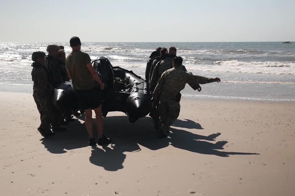 Marines and Sailors prepare Zodiac boat