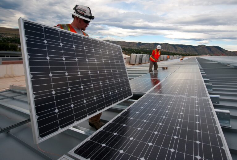 Installing PV panels on the roof at the Research Support Facility, RSF