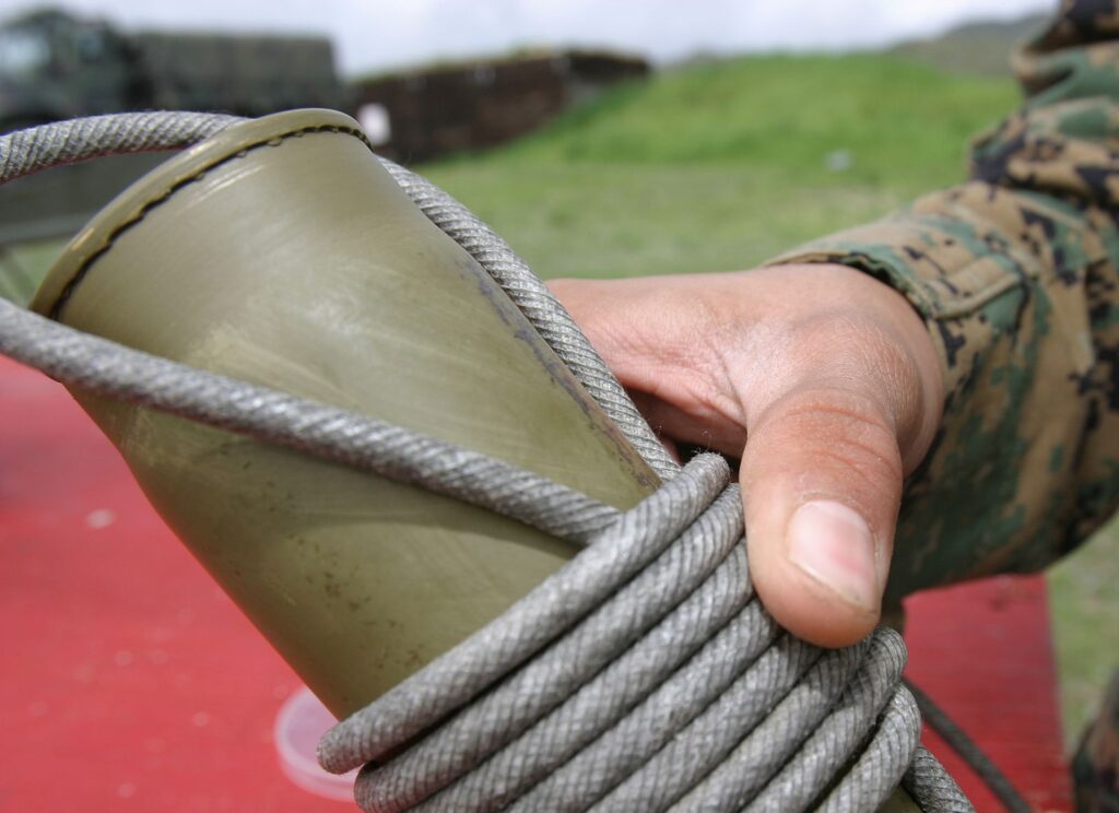 Rolled detonation cord around cartridge