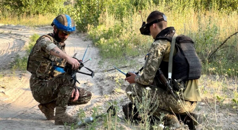 Ukrainian soldiers with strike drones