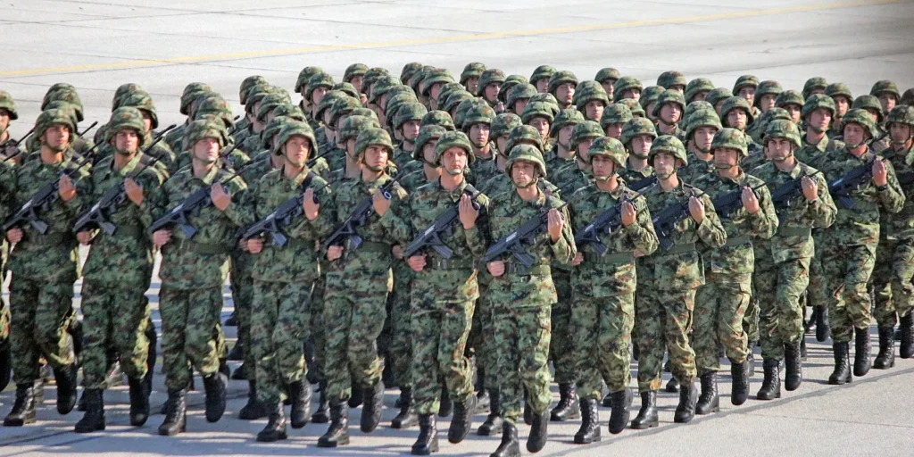 Serbian soldiers carrying the M21 Zastava
