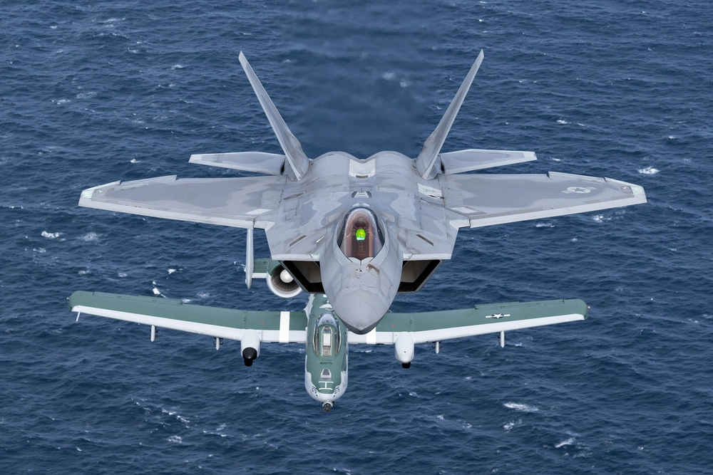 F-22 flies alongside A-10