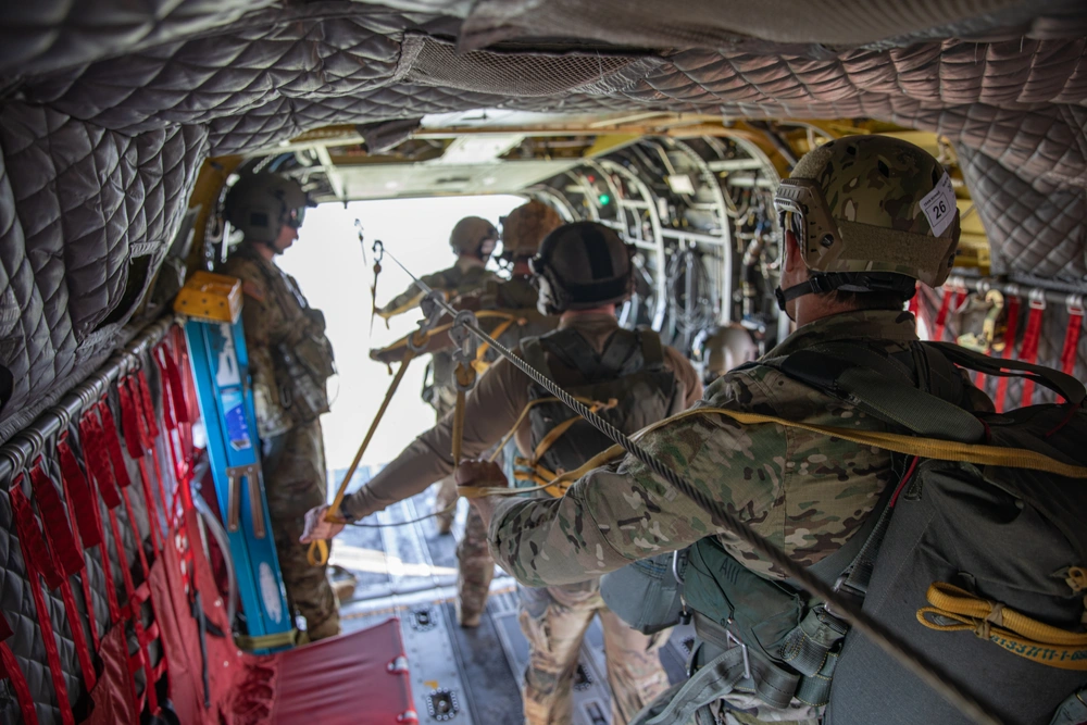 Army paratroopers prepare to jump