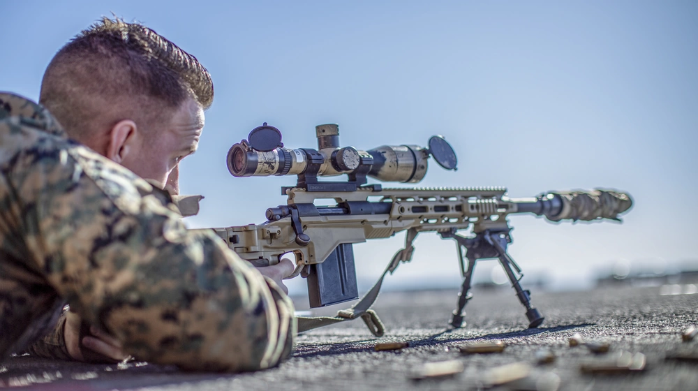 Marine sniper fires silenced M406 rifle