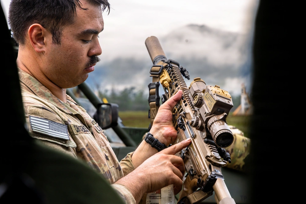 Soldier looks at M7 Next-Generation Rifle