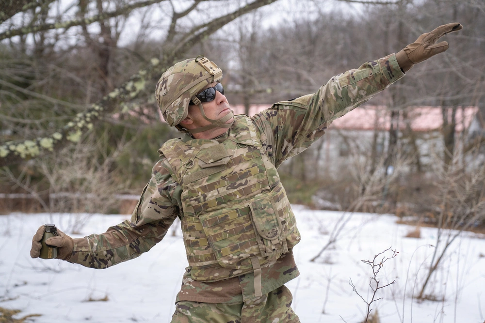 Soldier throws the M111 grenade