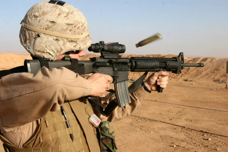 Marine fires M16A4 rifle with vertical grip