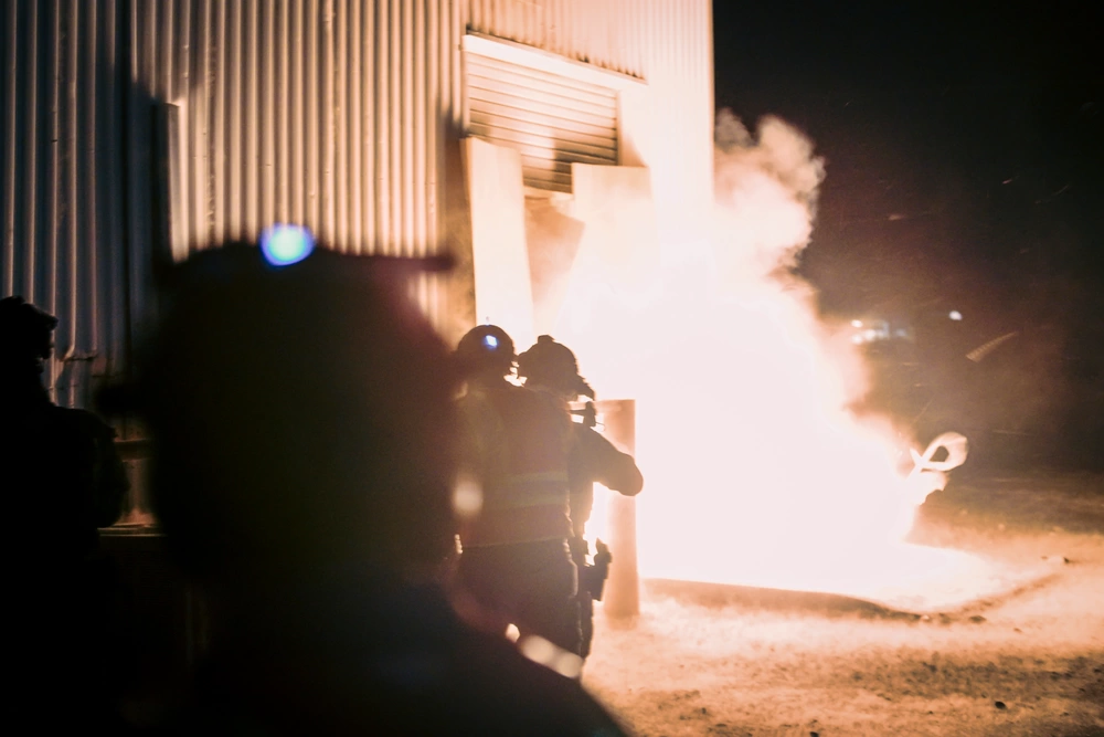 Marines breach door during raid