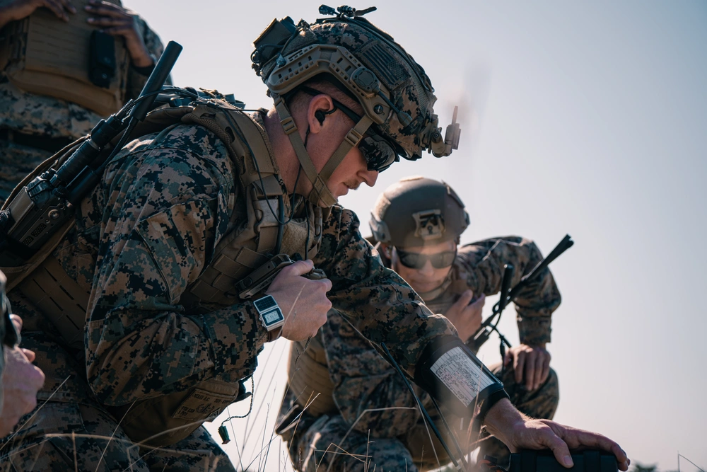 Marines place payload on drone during competition