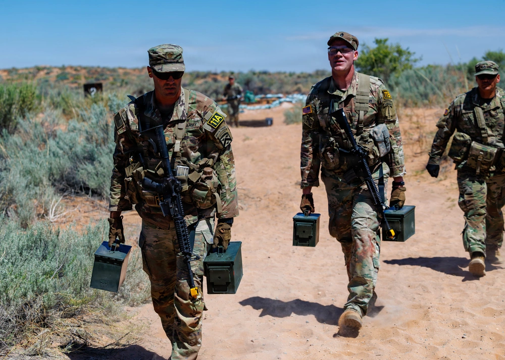 soldiers carrying ammo cans